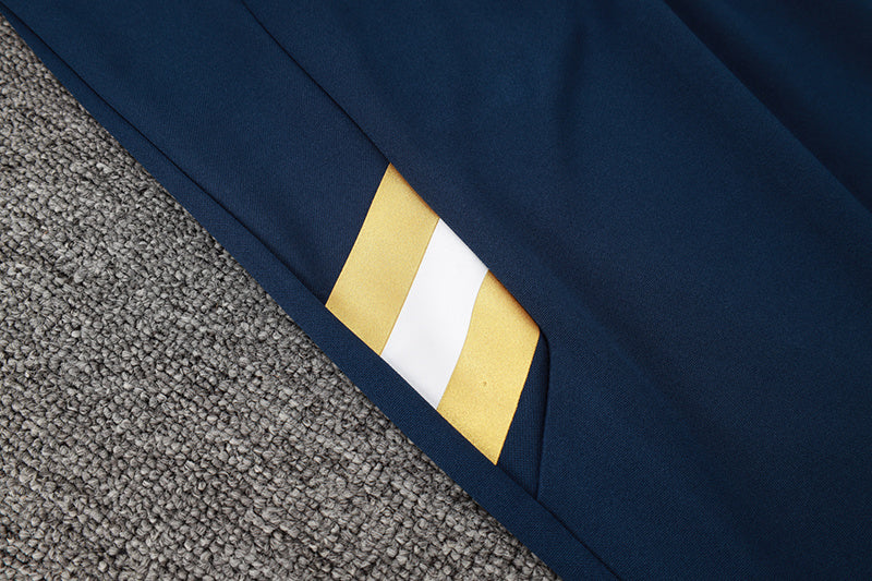 Tuta Sport Bianco e Blu dettagli Gialli