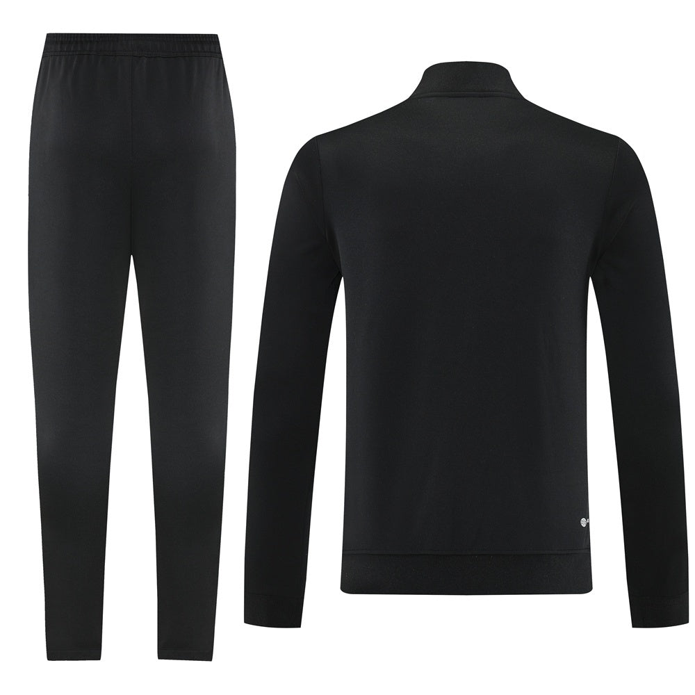 Tuta Sport nero e arancione riga bianca