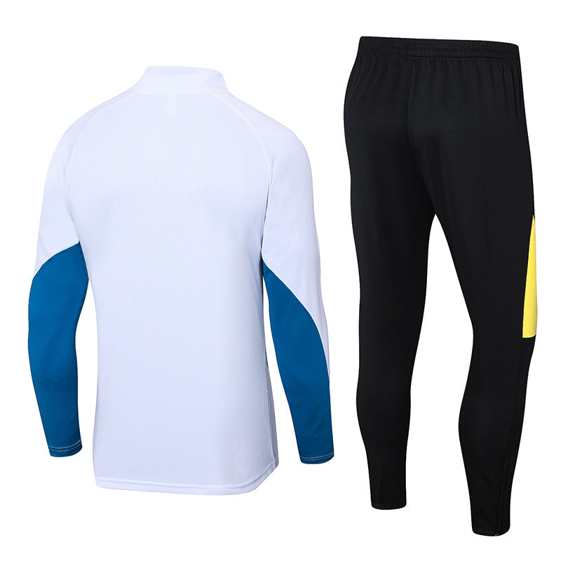Tuta Sport Bianco e Nero dettagli Gialli e Azzurri