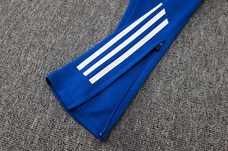 Tuta Sport Bianco e Azzurro dettagli arancioni